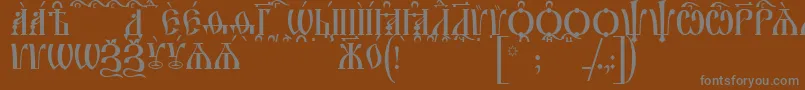 フォントIrmologionCapsKucs – 茶色の背景に灰色の文字