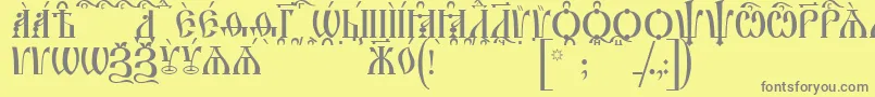 IrmologionCapsKucs Font – Gray Fonts on Yellow Background