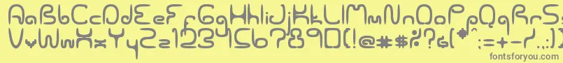 フォントSpaceworm02Erc2006 – 黄色の背景に灰色の文字
