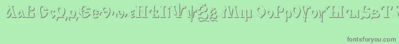 フォントIzhitsashadowcttRegular – 緑の背景に灰色の文字