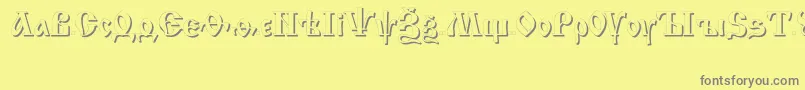 フォントIzhitsashadowcttRegular – 黄色の背景に灰色の文字