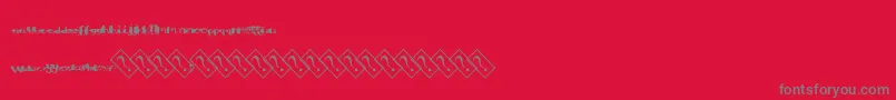 フォントAquacolor – 赤い背景に灰色の文字