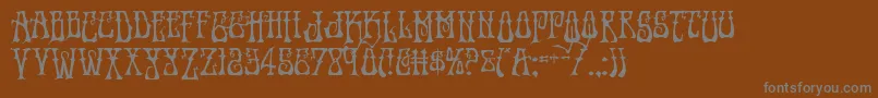 Instantzendrop-Schriftart – Graue Schriften auf braunem Hintergrund