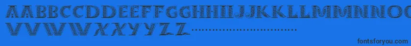 Dropcaps Font – Black Fonts on Blue Background
