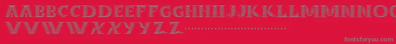 Dropcaps Font – Gray Fonts on Red Background