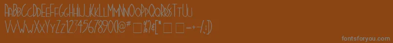 Шрифт Stigmata – серые шрифты на коричневом фоне
