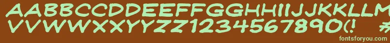 フォントJeffreyprintJlWideItalic – 緑色の文字が茶色の背景にあります。