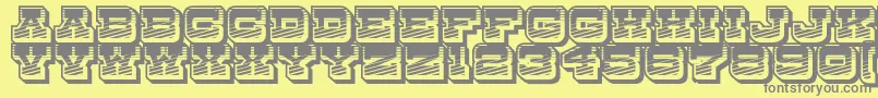 DryGoodsRusticJl-fontti – harmaat kirjasimet keltaisella taustalla