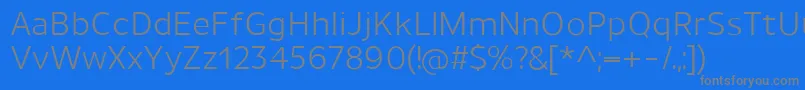 フォントUnimanRegular – 青い背景に灰色の文字