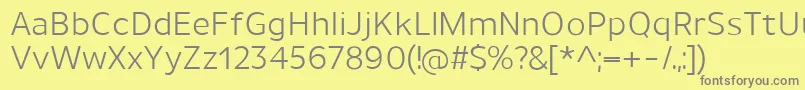 UnimanRegular-fontti – harmaat kirjasimet keltaisella taustalla