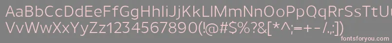 フォントUnimanRegular – 灰色の背景にピンクのフォント