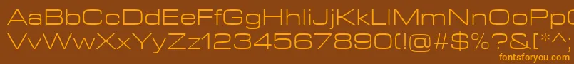 EurostileNextLtComLightExtended-fontti – oranssit fontit ruskealla taustalla