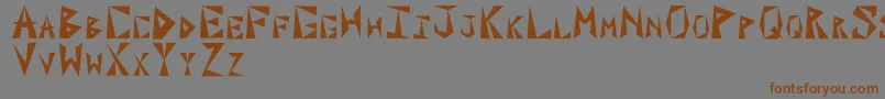 PaxilInitialsフォントについての詳細 フォントPaxilInitials – 茶色の文字が灰色の背景にあります。