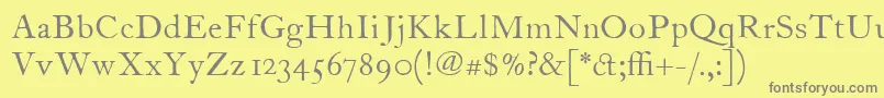 ItcFoundersCaslon12Roman-fontti – harmaat kirjasimet keltaisella taustalla