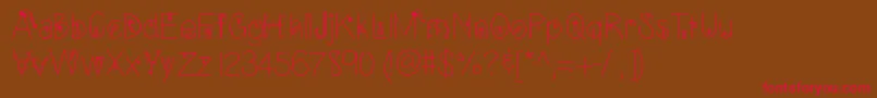 フォントFontsplaceChristmasEditionРћР±С‹С‡РЅС‹Р№ – 赤い文字が茶色の背景にあります。