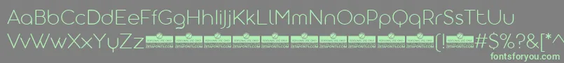 AristotelicaDisplayExtralightTrial Font – Green Fonts on Gray Background