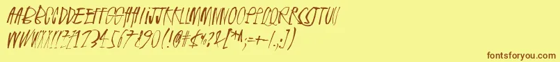 フォントRhinoceros – 茶色の文字が黄色の背景にあります。