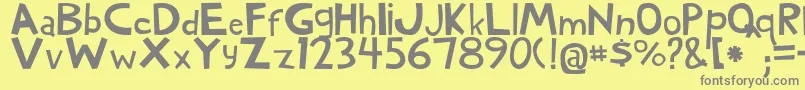 WoodyNormal-Schriftart – Graue Schriften auf gelbem Hintergrund