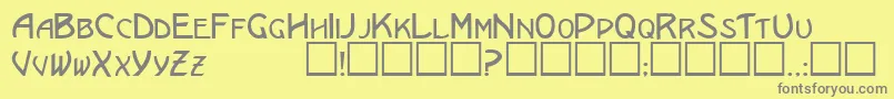 EricanscapssskRegular-fontti – harmaat kirjasimet keltaisella taustalla