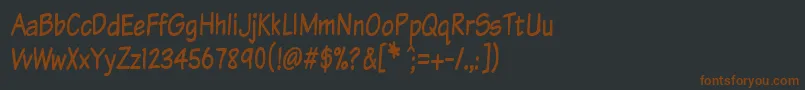 Komtxtt Font – Brown Fonts on Black Background