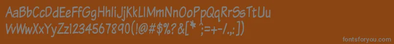 Komtxtt Font – Gray Fonts on Brown Background