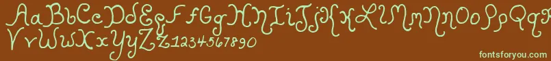 フォントKristenCurly – 緑色の文字が茶色の背景にあります。
