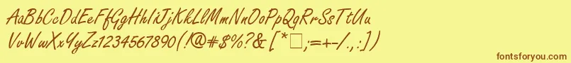 フォントFreeport – 茶色の文字が黄色の背景にあります。