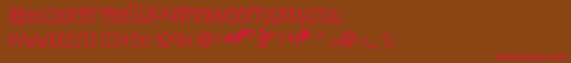 フォントThatpaper – 赤い文字が茶色の背景にあります。
