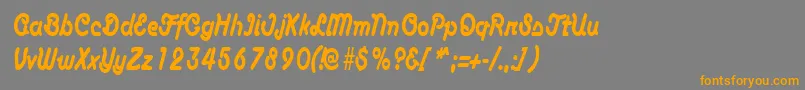 フォントAnacondacondensedRegular – オレンジの文字は灰色の背景にあります。