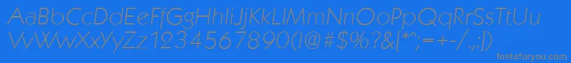 KoblenzserialXlightItalic-fontti – harmaat kirjasimet sinisellä taustalla