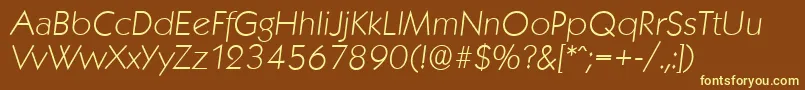 KoblenzserialXlightItalic-fontti – keltaiset fontit ruskealla taustalla