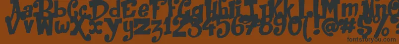 JackInTheBox Font – Black Fonts on Brown Background