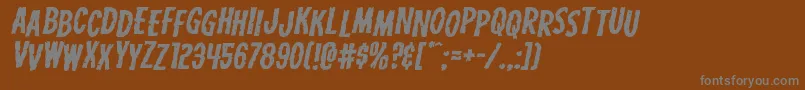 Carnivalcorpsestagexpandital-Schriftart – Graue Schriften auf braunem Hintergrund