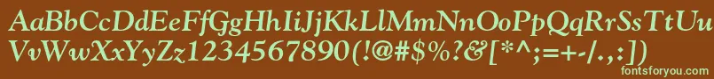 フォントGoudystdBolditalic – 緑色の文字が茶色の背景にあります。