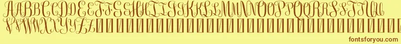 FreemonogramBeta0.5-Schriftart – Braune Schriften auf gelbem Hintergrund