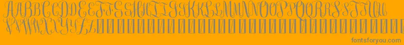 FreemonogramBeta0.5-Schriftart – Graue Schriften auf orangefarbenem Hintergrund