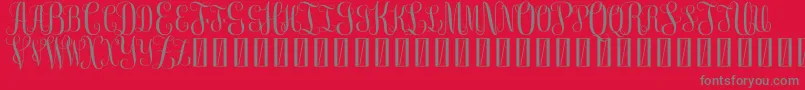 Шрифт FreemonogramBeta0.5 – серые шрифты на красном фоне