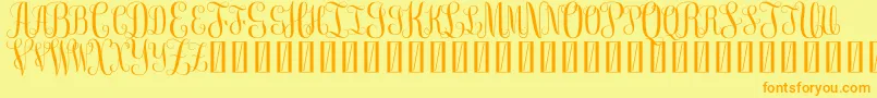 FreemonogramBeta0.5-Schriftart – Orangefarbene Schriften auf gelbem Hintergrund