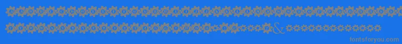 フォントStuckedInGears – 青い背景に灰色の文字