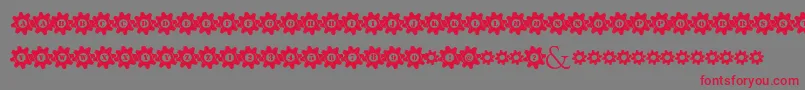 フォントStuckedInGears – 赤い文字の灰色の背景