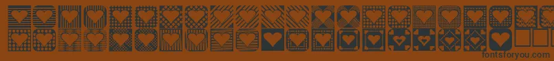 フォントHeartthings2 – 黒い文字が茶色の背景にあります