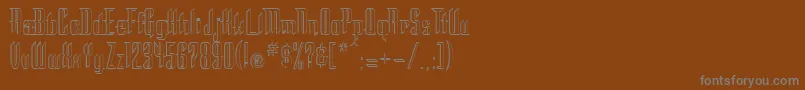 フォントStc – 茶色の背景に灰色の文字