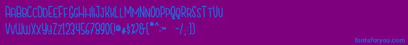 CutiescapsFree-Schriftart – Blaue Schriften auf violettem Hintergrund