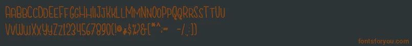Шрифт CutiescapsFree – коричневые шрифты на чёрном фоне