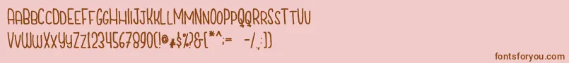 CutiescapsFree Font – Brown Fonts on Pink Background