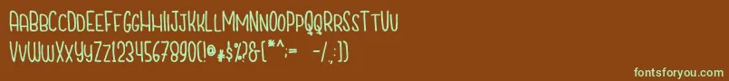 CutiescapsFree Font – Green Fonts on Brown Background