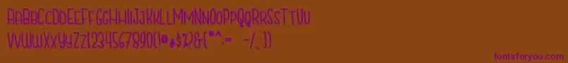 CutiescapsFree Font – Purple Fonts on Brown Background
