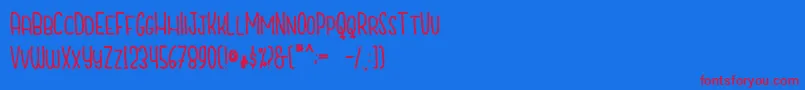 CutiescapsFree-Schriftart – Rote Schriften auf blauem Hintergrund