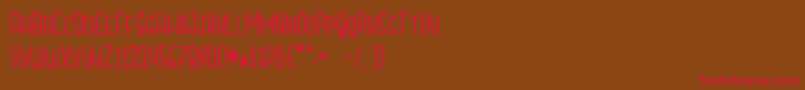 CutiescapsFree Font – Red Fonts on Brown Background