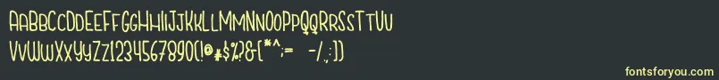 CutiescapsFree Font – Yellow Fonts on Black Background
